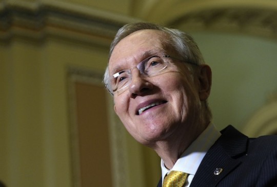 Koch-funded multi-millionaire and Senate Majority Leader Harry Reid thinks about money and smiles. (AP)