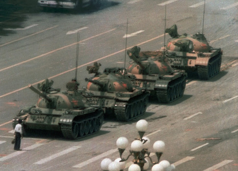 A Chinese man stands alone to block a line of tanks in Tiananmen Square on June 5, 1989. / AP