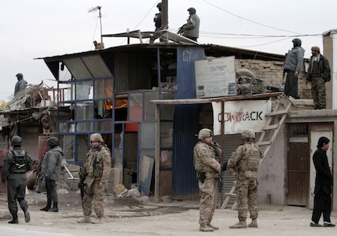 Afghan police and U.S. forces respond to a suicide car bomb attack on the Jalalabad-Kabul road in Kabul De. 27, 2013