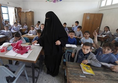 Palestinian children attend a class at the UNRWA elementary school in Shati refugee camp in Gaza City