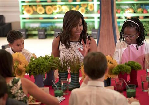 Michelle Obama sits with winners of 2016 Kids' Healthy Lunchtime Challenge in the East Room of the White House
