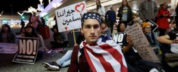 Demonstrators shut down the traffic loops at LAX International Airport and yell slogans during a protest against the travel ban imposed by U.S. President Donald Trump's executive order, at Los Angeles International Airport in Los Angeles