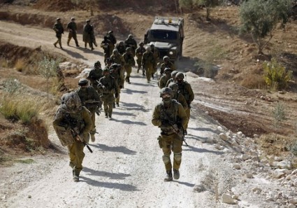 Israeli soldiers leave after an operation near Ramallah
