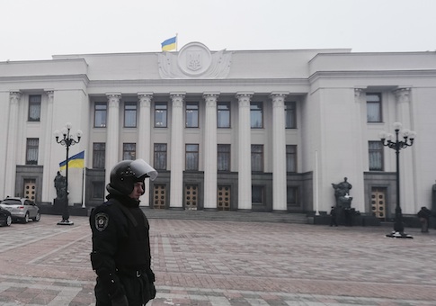 A riot policeman stands on duty outside the Parliament in Kiev
