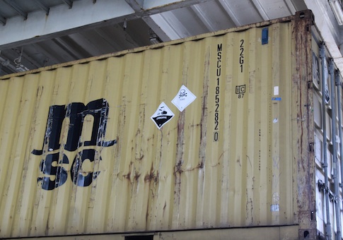 Signs are seen on one of the containers carrying precursors to sarin gas on the deck of the Ark Futura