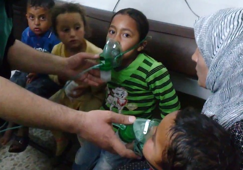 Children receive oxygen in village attacked with poisonous chlorine gas