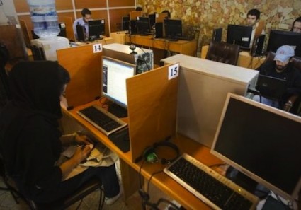 Customers use computers at an internet cafe in Tehran May 9, 2011.