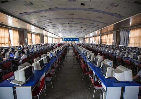 Chinese students learn computer skills in a computer room at Lanxiang Vocational School