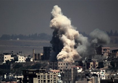 Smoke and sand are seen following what witnesses said was an Israeli air strike in Gaza August 25