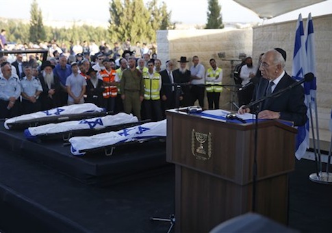 Israeli President Shimon Peres, right, eulogizes the three Israeli teens who were abducted and killed in the occupied West Bank