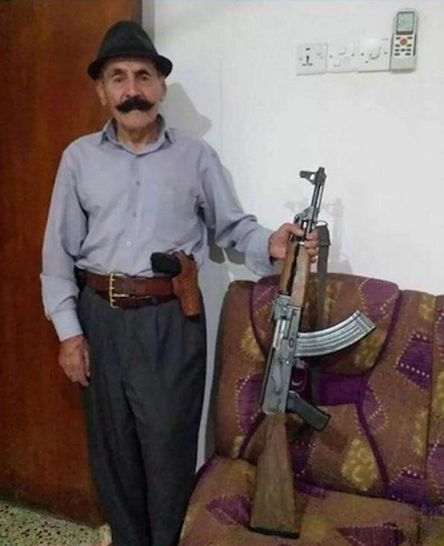 WFB ombudsman Biff Diddle poses with an AK-47 near Erbil, Kurdistan. (AP)