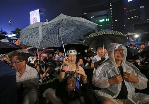 Protesters attend a protest rally in Hong Kong Sunday, Aug. 31