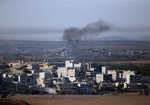 Smoke from a fire rises following a strike in Kobani, Syria