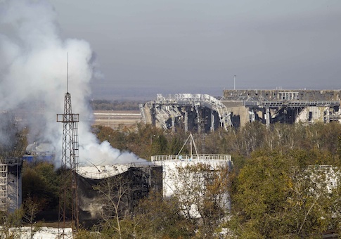 Smoke rises near the damaged main terminal of the Donetsk Sergey Prokofiev International Airport during fighting between pro-Russian rebels and Ukrainian government forces in Donetsk, eastern Ukraine, October 4