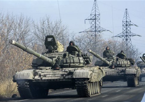 Pro-Russian rebel military vehicles convoy move towards Donetsk , Eastern Ukraine, Monday, Nov. 10