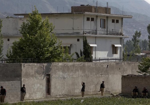 Members of the anti-terrorism squad are seen surrounding the compound where al Qaeda leader Osama bin Laden was killed in Abbottabad