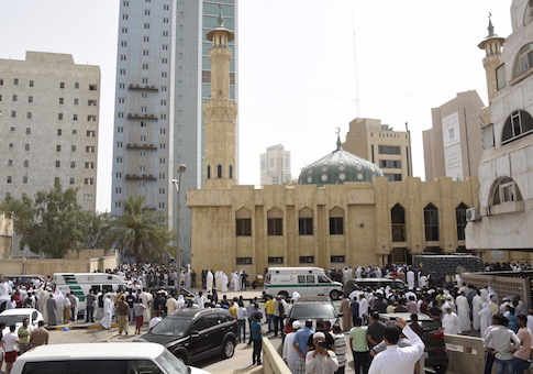Ambulances park in front of the Imam Sadiq Mosque after a bomb explosion following Friday prayers, in the Al Sawaber area of Kuwait City