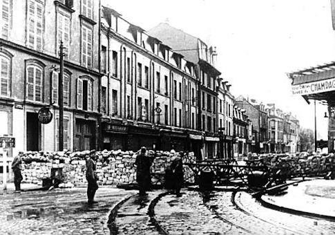 German Nazis block the streets with barricades after invading the city of Reims, France, on June 12, 1940 during World War II