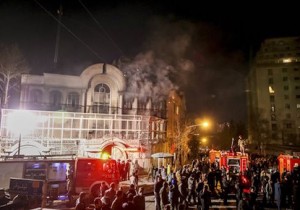 Smoke rises as Iranian protesters set fire to the Saudi embassy in Tehran