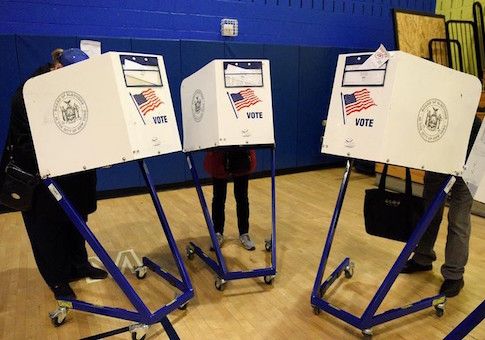 Voters cast their ballots during the U.S. presidential election at Public School P.S. 59 in the Manhattan borough of New York