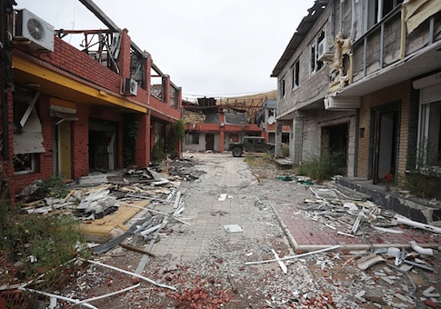 The town of Shyrokyne, in the Donetsk region, shows a street with buildings destroyed by pro-Russian separatists shelling