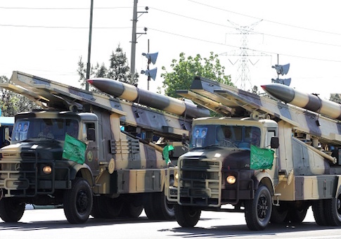 Iranian military trucks carry surface-to-air missiles during a parade on the occasion of the country's Army Day, on April 18