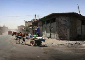 Iraqis ride a cart in western Mosul's old city