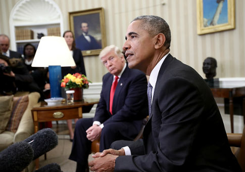 Donald Trump listens as Barack Obama speaks in White House / Getty