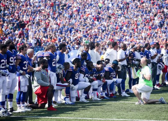 Marcell Dareus of the Buffalo Bills kneels during the American National anthem before an NFL game against the Denver Broncos