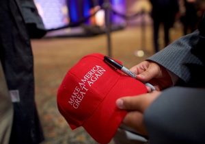 A supporter holds a "Make America Great Again" – MAGA – hat for an autograph, before Republican Presidential nominee Donald Trump holds an event in Gettysburg, Pa. / Getty Images