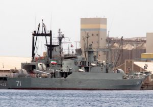 Iranian military frigate and light replenishment ship are seen docked for refueling