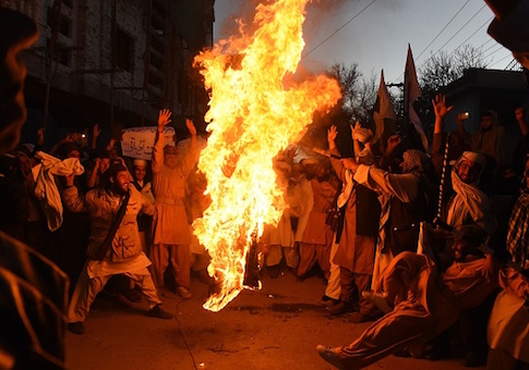 Pakistani demonstrators burn the US flag at a protest in Quetta on January 4