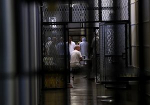 Inmates sits in housing block at San Quentin State Prison