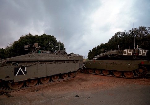 Israeli Merkava tanks parked near the border with Lebanon, after the area was declared a closed military zone by the Israeli army