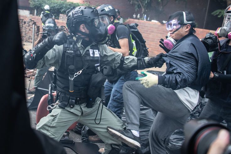 Police arrest anti-government protesters at Hong Kong Polytechnic University