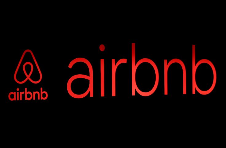 FILE PHOTO: The logos of Airbnb are displayed at an Airbnb event in Tokyo