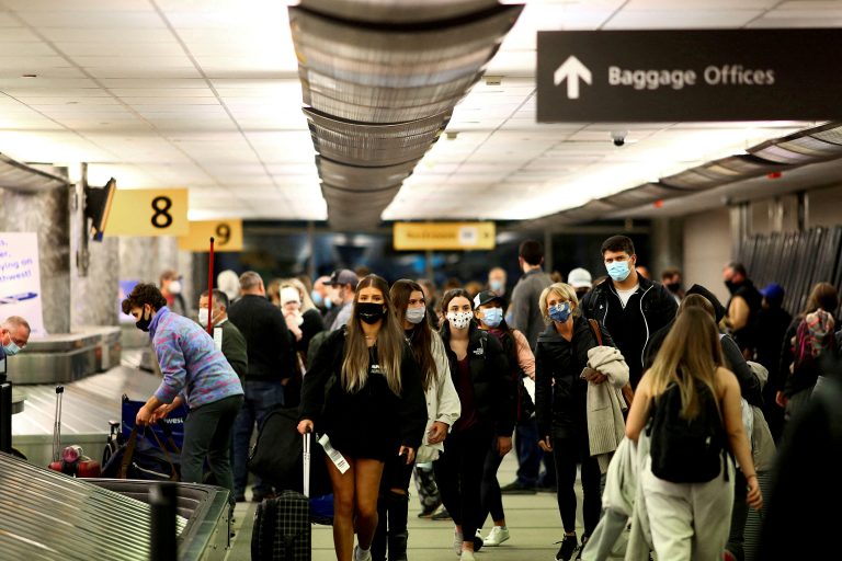 People wearing masks at an airport